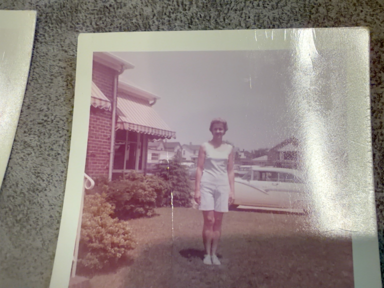 Viola Samuel standing outdoors near a car.